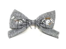 Load image into Gallery viewer, RIBBED BOW CLIP WITH FOIL WINK

