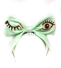 Load image into Gallery viewer, RIBBED BOW HEADBAND WITH FOIL WINK
